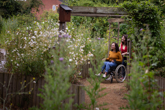 Two people in Walthamstow Wetlands nature reserve