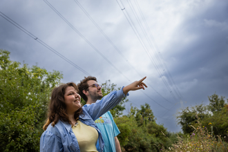 Two people looking out at Walthamstow Wetlands