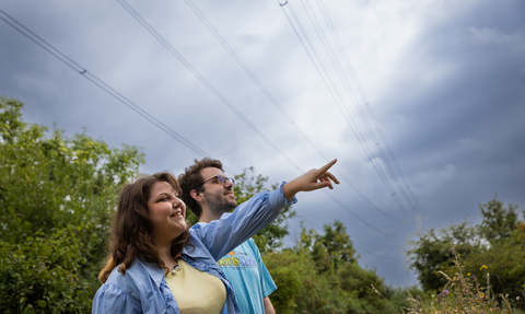 Two people looking out at Walthamstow Wetlands