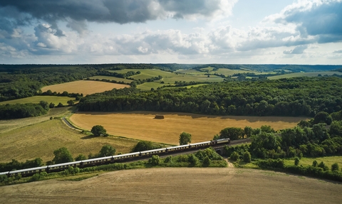 aerial image of the British Pullman train moving through the landscape