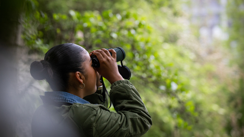 Young person bird watching 