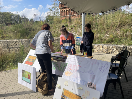 Young people at stall at Camley Street Natural Park 