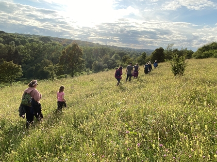 Group of people walking through a field