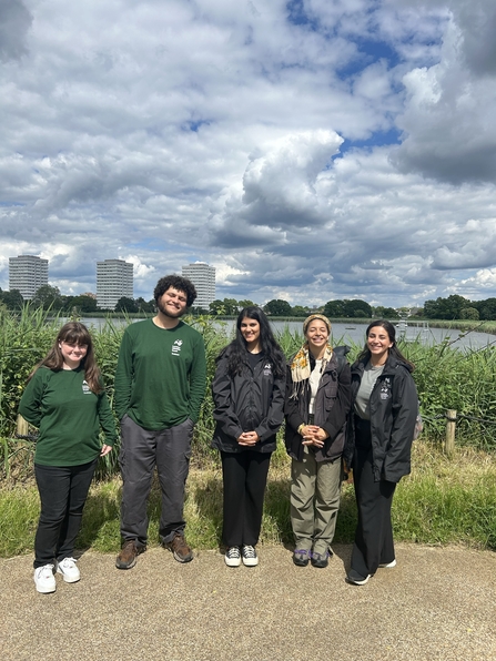 Caroline alongside her fellow trainees, 4 four other young people.