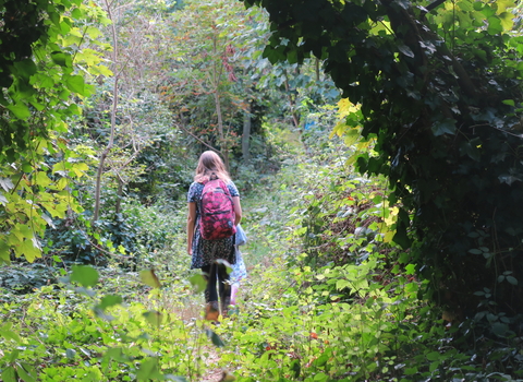 New Cross Gate Cutting open day - woman walking in the reserve